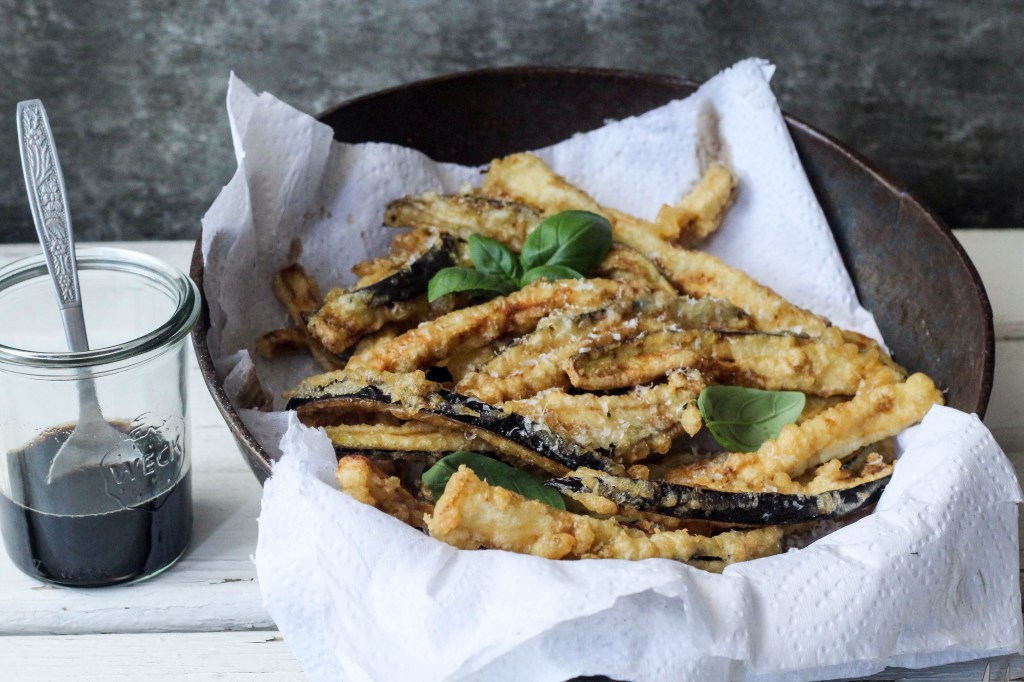 Aubergine fries with a honey balsamic&nbsp;drizzle.