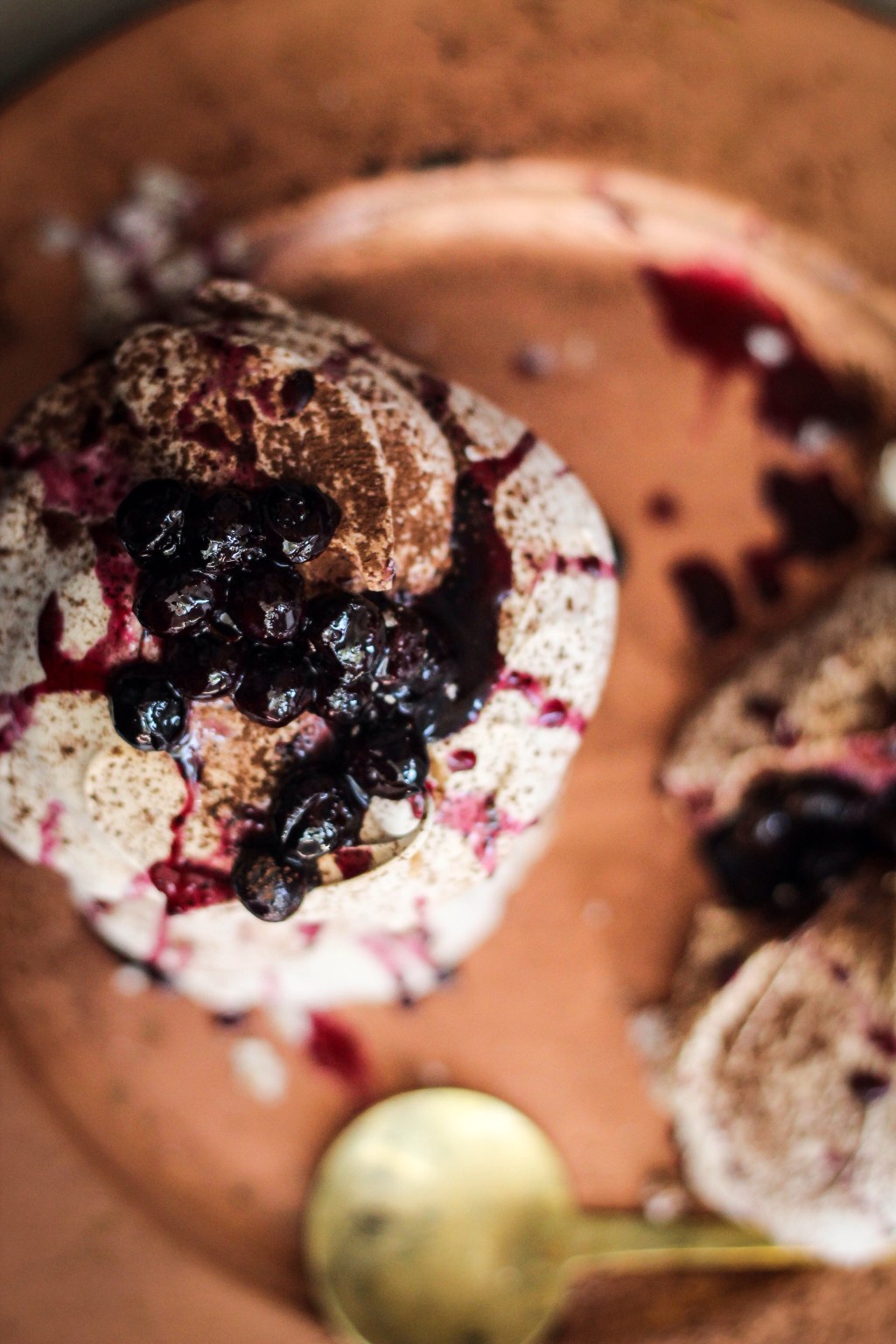 Cocoa powder dusted Pavlovas with Blueberry compote. 